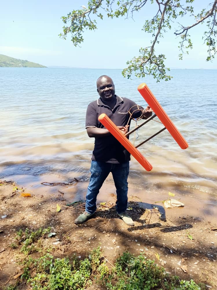 Leo holding fishing equipment